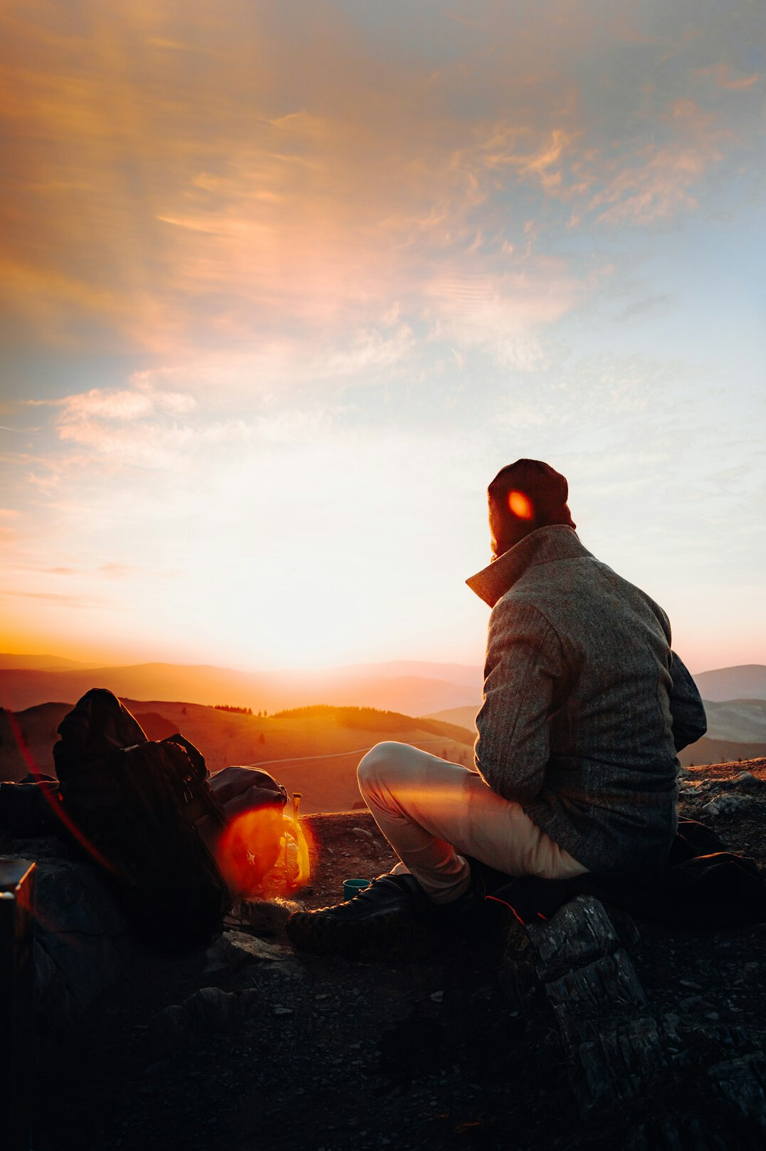 person journaling at sunrise