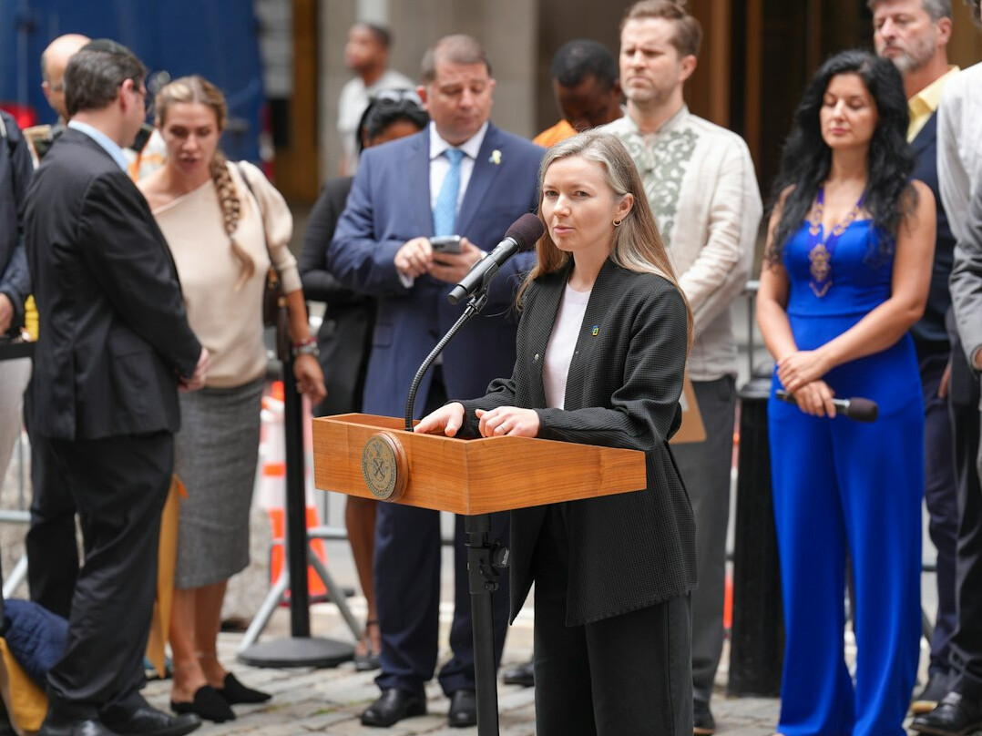 woman speaking confidently at podium