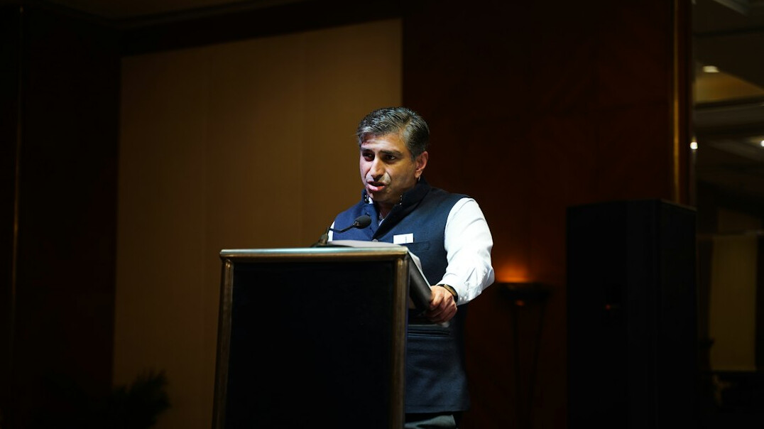 man speaking confidently at conference